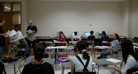 Ms. Palmer (left) guides discussion groups through a Case Study