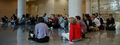 Students pay close attention to their fellow classmate's presentation